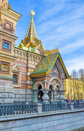 SAINT PETERSBURG, RUSSIA - APRIL 25, 2015: The porch entrance to the Church of Savior on Spilled Blood, decorated with colorful tiled roof, icons, columns, double-headed golden eagle, on April 25 in Saint Petersburg.のeditorial素材