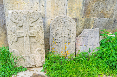The khachkars decorated with floral patterns, combine some geometric elements and old Armenian inscriptions, Tatev Monastery, Syunik Province, Armenia.の写真素材
