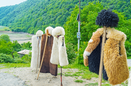 The Georgian shepherds' costume - the hat (papakha) and coat of sheep's fur are the best choice for cold mountain weather, Ananuri, Georgia.の写真素材