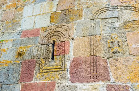 The wall of Tsminda Sameba (Holy Trinity) Church with the old preserved carved ornamentations and...