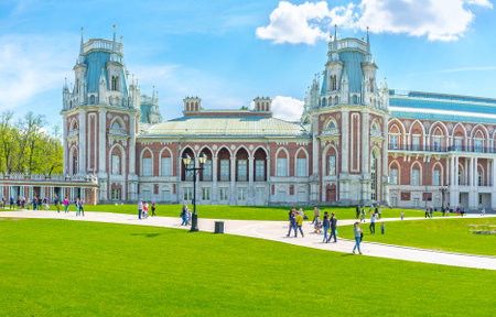 MOSCOW, RUSSIA - MAY 10, 2015: The facade of the Grand Palace of Tsaritsyno Royal Residence decorated with towers, patterns, fretwork and surrounded by lawn, on May 10 in Moscow.のeditorial素材