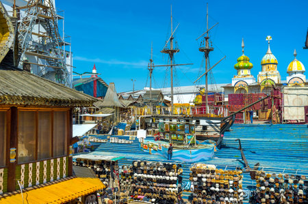 MOSCOW, RUSSIA - MAY 10, 2015: The wooden ship sails in painted timbered sea in the middle of the souvenir Vernissage market in Izmailovo, on May 10 in Moscow.のeditorial素材