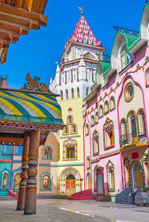 The colorful mansions of art galleries, souvenir stores and restaurants with the tower in corner, Izmailovsky Kremlin, Russia.のeditorial素材
