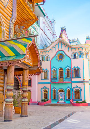 The painted buildings of the modern quarter around the Tsar's Palace looks like gingerbread houses or fairy tale palaces, Izmailovo, Moscow, Russia.のeditorial素材