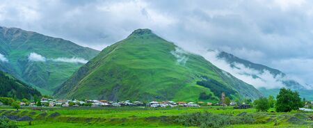 The  historic village of Sno, located in gorge, covered with heavy rainy clouds, Georgia.