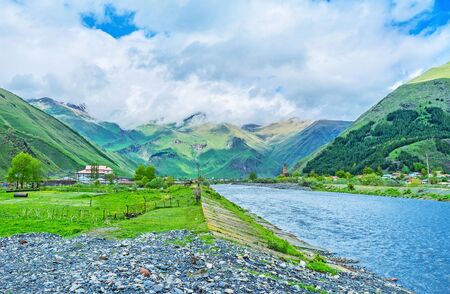 The walk along the bank of the Snostskali river in Sno gorge with the view on the medieval castle on...