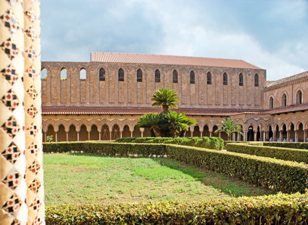 MONREALE, ITALY - OCTOBER 10, 2016: The Monreale Cloister's garden is the best place to enjoy the medieval mix of Norman, Byzantine and Arab art, discovering the patterns of its columns, on October 10 in Monreale.のeditorial素材