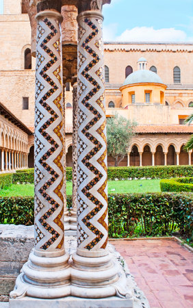 The white stone columns in garden of Monreale Cathedral decorated with zigzag inlay, consisting of small mosaic stars, Sicily, Italy.のeditorial素材