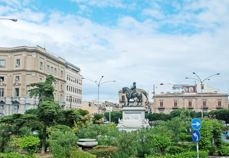 PALERMO, ITALY - OCTOBER 2, 2012: The monument to Vittorio Emanuele II, surrounded by lush garden in Square of Giulio Cesare, on October 2 in Palermo.のeditorial素材