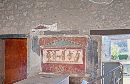 POMPEII, ITALY - OCTOBER 4, 2012: The interior of Thermopolium of Asellina, the food store or cafe in ancient Roman cities, decorated with fresco, depicting gods, on October 4 in Pompeii.のeditorial素材