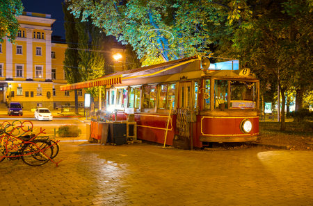 KIEV, UKRAINE - SEPTEMBER 11, 2016: The old tram in Taras Shevchenko park serves as the outdoor cafe, on September 11 in Kiev.のeditorial素材
