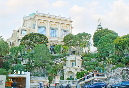 MONACO - FEBRUARY 21, 2012: The zig-zag staircase with sculptures, surrounded by garden, leads from the Avenue Spelugues to Casino Square, on February 21 in Monaco.のeditorial素材