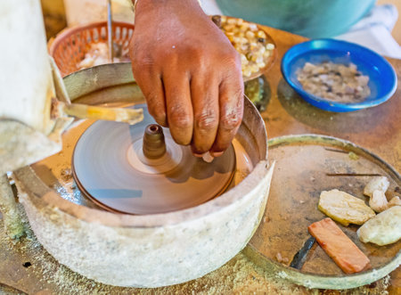 The close-up of cutting the moonstone on the diamond blade in jewelry manufacture, Meetiyagoda, Sri Lanka.のeditorial素材