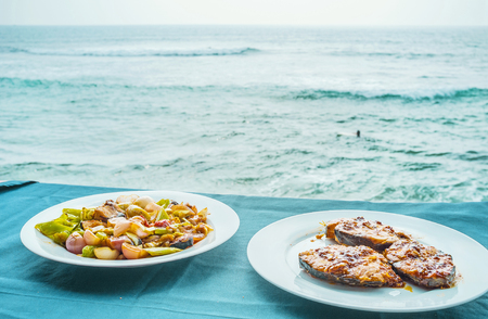 The cuisine of Sri Lanka is rich in fish dishes, including fish on barbecue or deviled with vegetables, local resorts are best places to enjoy it in cafes, Hikkaduwa.の写真素材