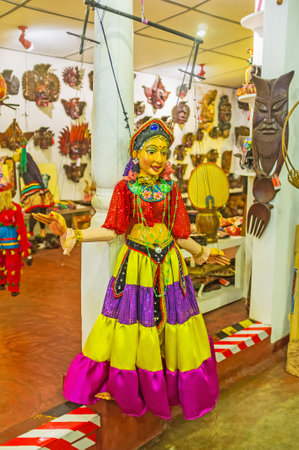 AMBALANGODA, SRI LANKA - DECEMBER 5, 2016: The puppet of the dancer in colorful dress in mask store, on December 5 in Ambalangoda.のeditorial素材