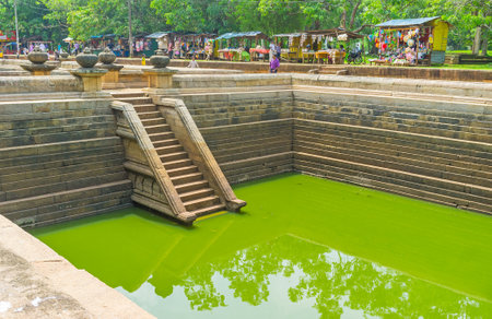 ANURADHAPURA, SRI LANKA - NOVEMBER 26, 2016: The embankment of the Twin Pools occupied with the tourist stalls, offering handmade souvenirs and fresh beverages, on November 26 in Anuradhapura.のeditorial素材