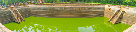 ANURADHAPURA, SRI LANKA - NOVEMBER 26, 2016: The large granite pool in archaeological site of Kuttam Pokuna (Twin Pools) is the perfect place to enjoy historic places of the Sacred City, on November 26 in Anuradhapura.のeditorial素材