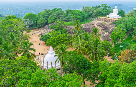 The Ambasthala Dagoba and Buddha Statue in Mihintale Temple, one of the most popular pilgrimage sites in Sri Lanka.のeditorial素材