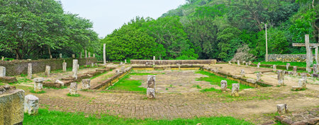 The ruins of the ancient Refectory of Buddhist Monks of Mihintale Monastery Complex, located on the mountain slope among the lush forest, Sri Lanka.のeditorial素材