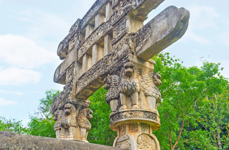 The Torana Gate of Mihintale replica of Great Sanchi Stupa decorated with lions, sitting under the beams of gateway and holding them, Sri Lanka.のeditorial素材