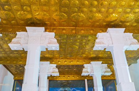 ANURADHAPURA, SRI LANKA - NOVEMBER 26, 2016: The golden ceiling in the Image House of Bodhi Tree Temple, decorated with relief patterns, on November 26 in Anuradhapura.のeditorial素材