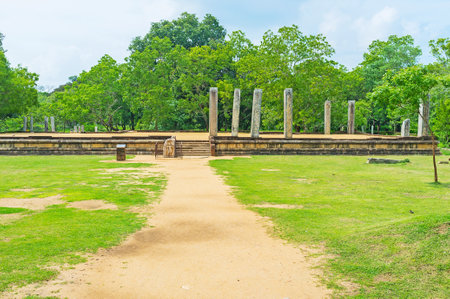 The archaeological site, known as ruins of Mahasena's Palace with preserved foundation, some pillars and the carved moonstone, Anuradhapura, Sri Lanka.のeditorial素材