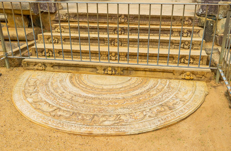 The beautiful carved moonstone at the stairs of Mahasena Palace, ldecorated with reliefs of animals, birds and patterns, Anuradhapura, Sri Lanka.のeditorial素材