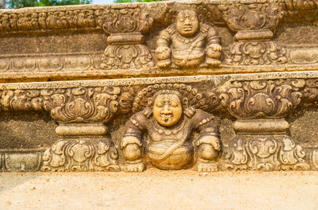 The stairs of the ruined Mahasena Palace decorated with the reliefs of dwarves, are one of the most beautiful preserved parts of the archaeological site, Anuradhapura, Sri Lanka.のeditorial素材
