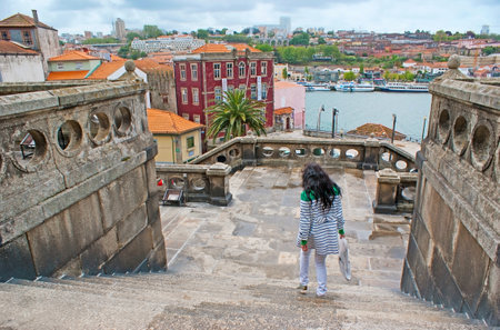 The view from the staircases of St Francis Church on the Arts School of Porto (ESAP), Douro River and roofs of Vila Nova de Gaia, Portugal.のeditorial素材