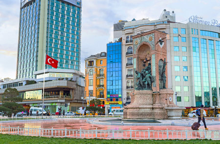 ISTANBUL, TURKEY - JANUARY 13, 2015:The Republic Monument with the numerous hotels and stores on the background, on January 13 in Istanbul.のeditorial素材