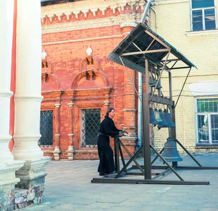 MOSCOW, RUSSIA - MAY 9, 2015: The young bell ringer in High Monastery of St Peter, on May 9 in Moscow.fのeditorial素材