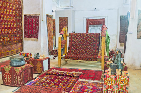 BUKHARA, UZBEKISTAN - APRIL 28, 2015: The interior of the Carpet museum with examples of traditional old carpets and the modern carpets for sell, on April 28 in Bukhara.のeditorial素材