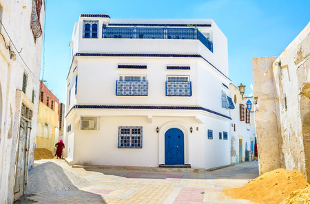 The large house, as for old arabic Medina, on the crossroad, Kairouan, Tunisia.