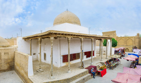 KHIVA, UZBEKISTAN, MAY 3, 2015: The Oq Masjid (White Mosque) located in the middle of traditional eastern market and became the part of it - here locates the large rug store, on May 3 in Khiva.のeditorial素材