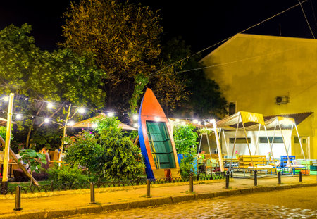 The boat, that is a part of the decoration of the summer terrace of the local cafe attracts clients in Odessa, Ukraine.のeditorial素材