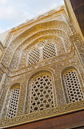 CAIRO, EGYPT - OCTOBER 10, 2014: The masterpiece islamic ornaments and arabic carved screens on windows in Qalawun complex, on October 10 in Cairo.のeditorial素材