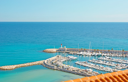 The numerous white yachts and motor boats in port of Menton, France.の写真素材