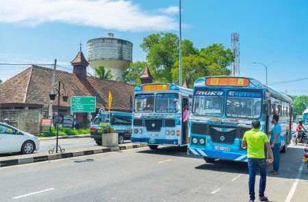 MATARA, SRI LANKA - DECEMBER 3, 2016: The colorful public buses pick up people on the move at the Nupe Junction, on December 3 in Matara.のeditorial素材