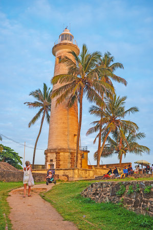 GALLE, SRI LANKA - DECEMBER 3, 2016: The old lighthouse, surrounded by palms, is one of the popular tourist places, on December 3 in Galle.のeditorial素材