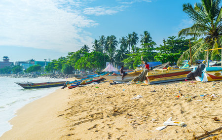 GALLE, SRI LANKA - DECEMBER 3, 2016: The fishing boats on the sand beach at the city fishing market, on December 3 in Galle.のeditorial素材
