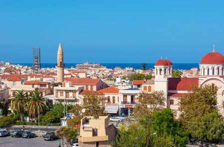 Rethymno is a multi religious city with a lot of churches and mosques with tall minarets, Greece.のeditorial素材