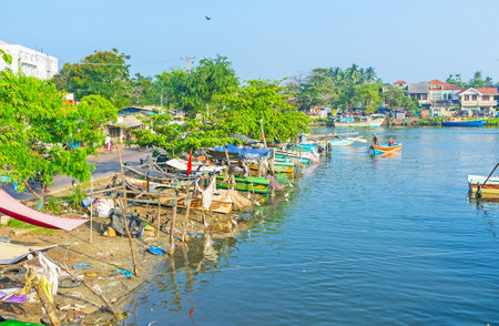 The shore of small boats in Negombo lagoon, fishermen make the sunshades to hide their boats and themselves of sun, Sri Lanka.のeditorial素材