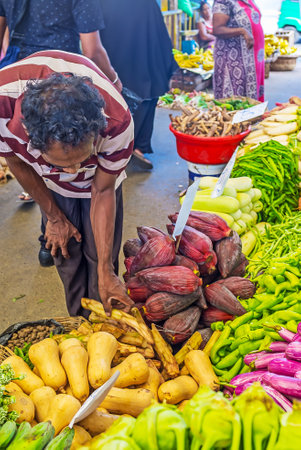 COLOMBO, SRI LANKA - DECEMBER 6, 2016: The heap of banana flowers among the vegetables at stall of Fose agricultural market, on December 6 in Colombo.のeditorial素材