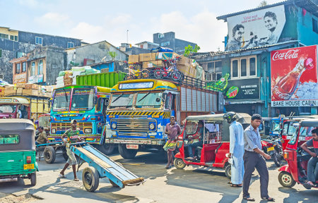 COLOMBO, SRI LANKA - DECEMBER 6, 2016: The colorful trucks, loaded with different goods on parking in Pettah, on December 6 in Colombo.のeditorial素材