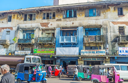 COLOMBO, SRI LANKA - DECEMBER 6, 2016: The facade of the battered Abdeen Building with the small shops on the ground floor, on December 6 in Colombo.のeditorial素材