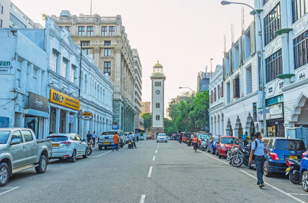COLOMBO, SRI LANKA - DECEMBER 6, 2016: The evening Chatham street with the view on the Old Lighthouse, the symbol of the city, on December 6 in Colombo.のeditorial素材