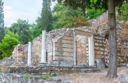 Antique ruins along round ancient peripatos street on the Hill of Acropolis in Athens, Greeceのeditorial素材