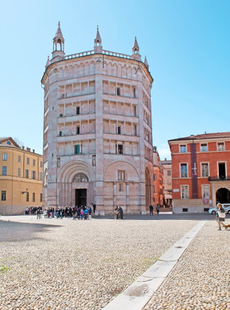 PARMA, ITALY - APRIL 24, 2012: The Baptistery, located on Piazza Duomo (Cathedral Square), built in Romanesque and Gothic Styles and covered by pink Verona marble, on April 24 in Parma.のeditorial素材