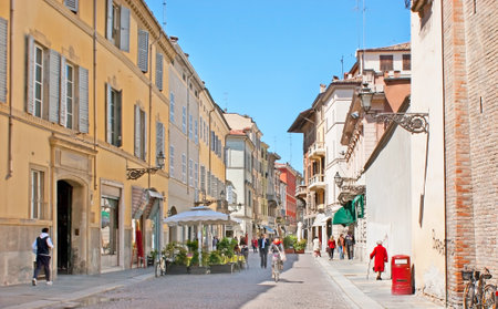 PARMA, ITALY - APRIL 24, 2012: The Cavour street is the perfect place for shopping or relax in cozy outdoor cafe in the old town center, on April 24 in Parma.のeditorial素材