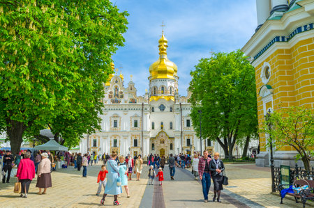 KIEV, UKRAINE - MAY 01, 2016: Central entrance to Dormition Cathedral is the place where people wait for easter sprinkling, on May 1, in Kiev.のeditorial素材